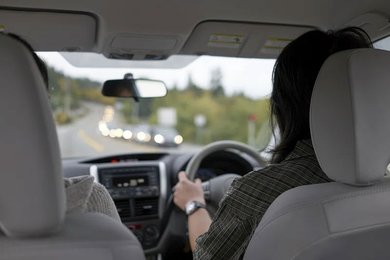 A woman driving a car